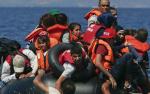 Syrian and Afghan refugees on raft reaching the Greek island of Lesbos, September 13, 2015. Reuters 